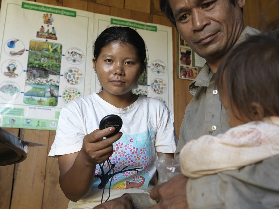 pRomas Dean is a village malaria worker in Ratanakiri Province who took part in the training After returning to her village she continues to diagnose and treat malaria diarrhoea and pneumonia in her rural community Here she used a respiratory rate timer to assess symptoms of a young child who had come to seek treatment at her housebr br Copyright Malaria ConsortiumPeter Catonp