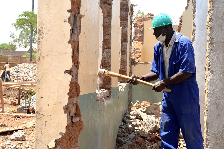 pMoses Owori Foreman helps to knock down the walls of the clinicnbspp