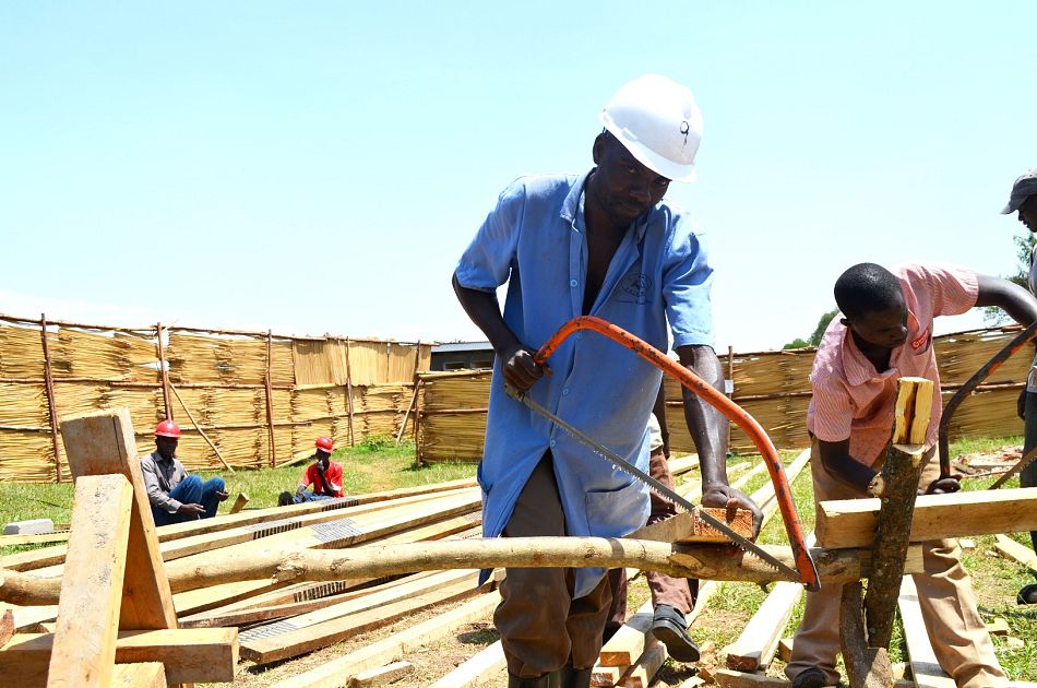 pOkongo Yokim Head Carpenter works with his team in the early stages of the renovationp