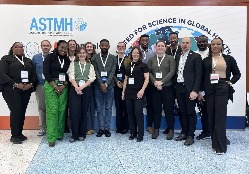 A group of Malaria Consortium staff pose for a photo at ASTMH 2025.
