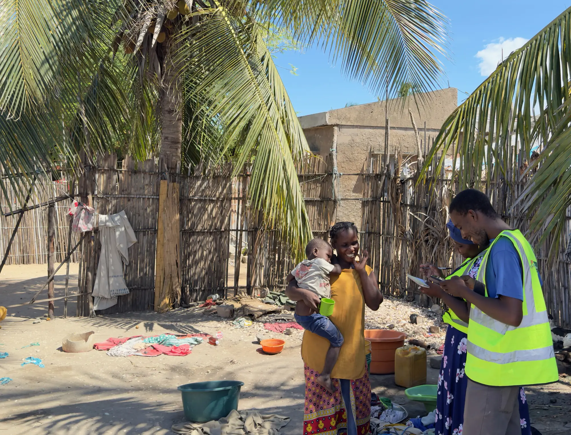 Seasonal malaria chemoprevention community distributor visits a household near Lumbo, Mozambique, April 2024
