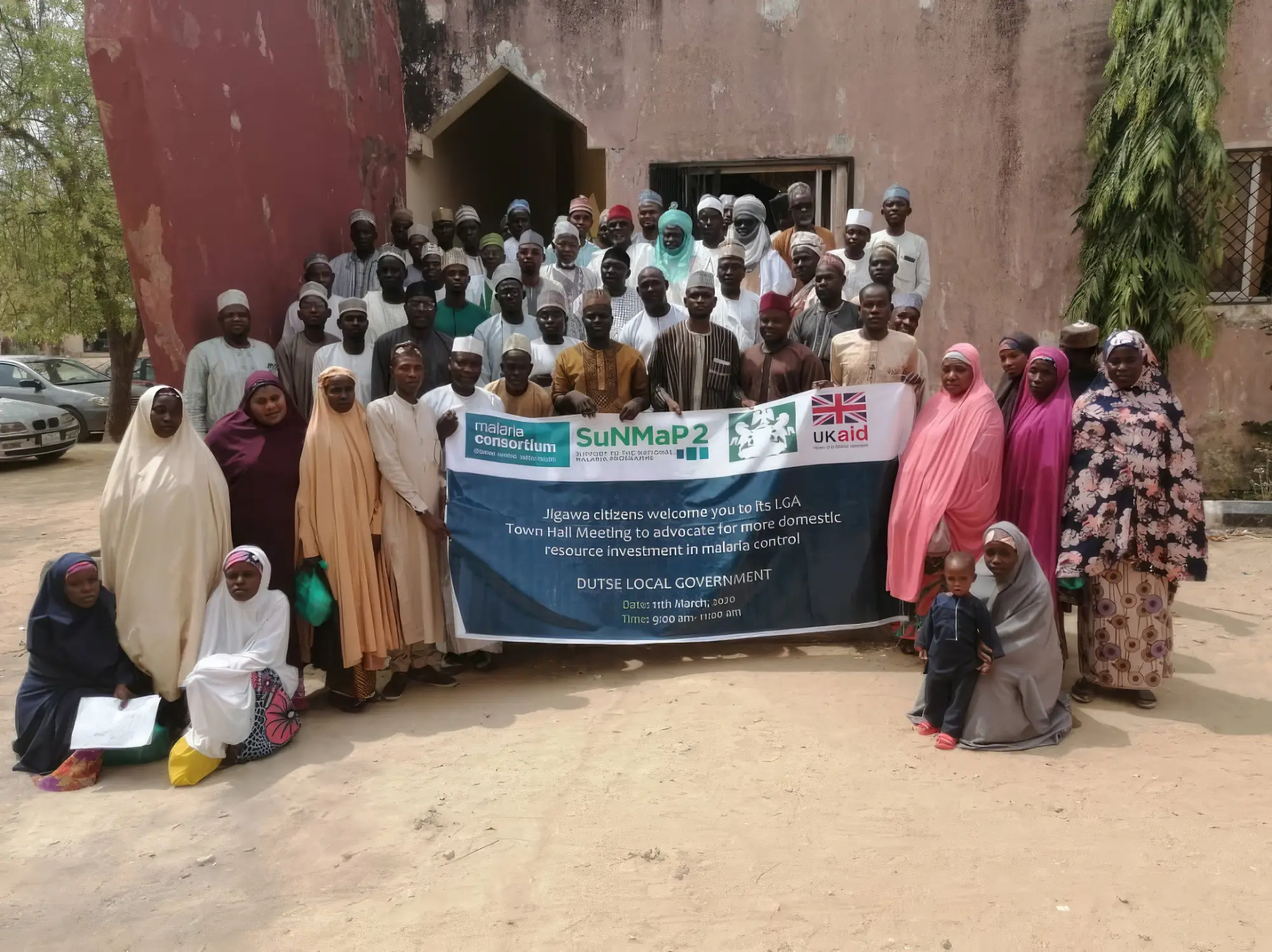The SuNMAP 2 team standing in front of the town hall in Nigeria, 2020