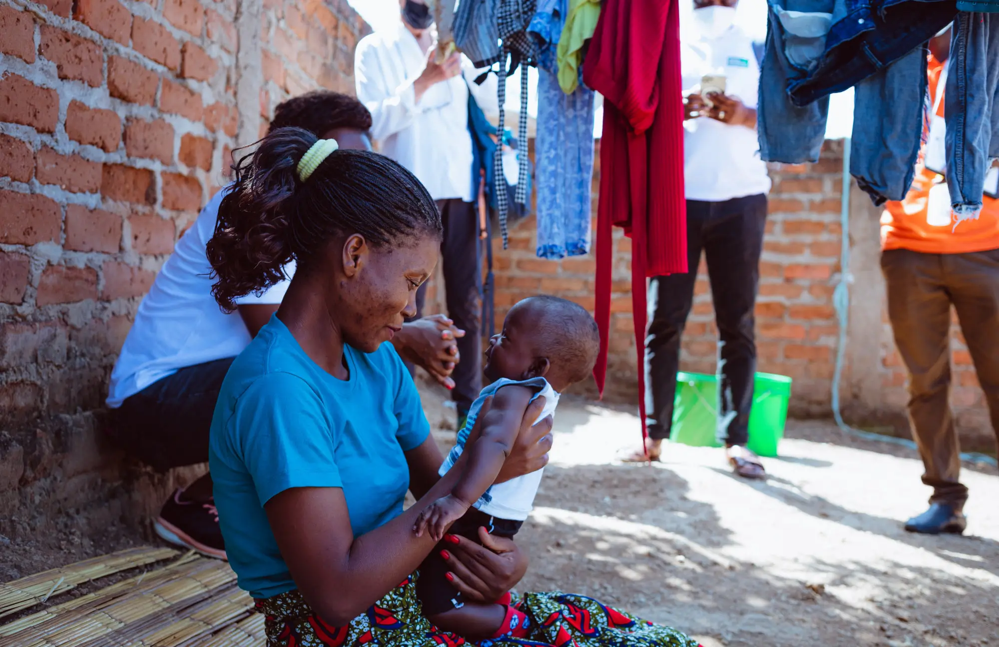 A woman holding a child in Malema, Mozambique in 2022
