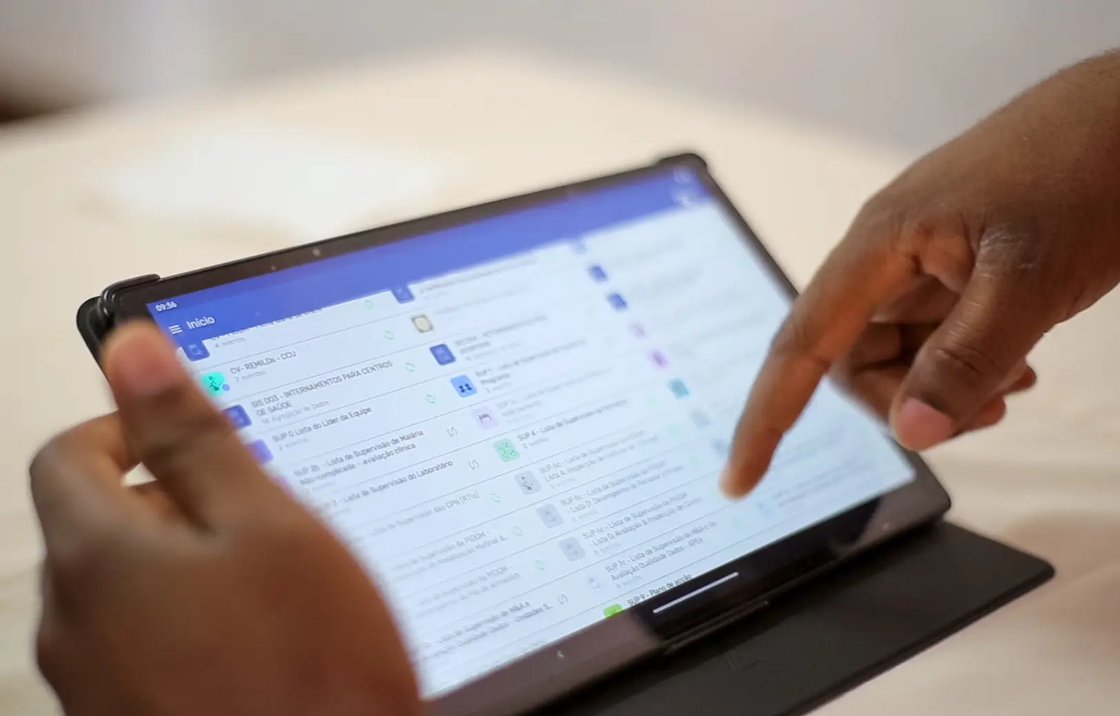 A person scrolls on a digital device