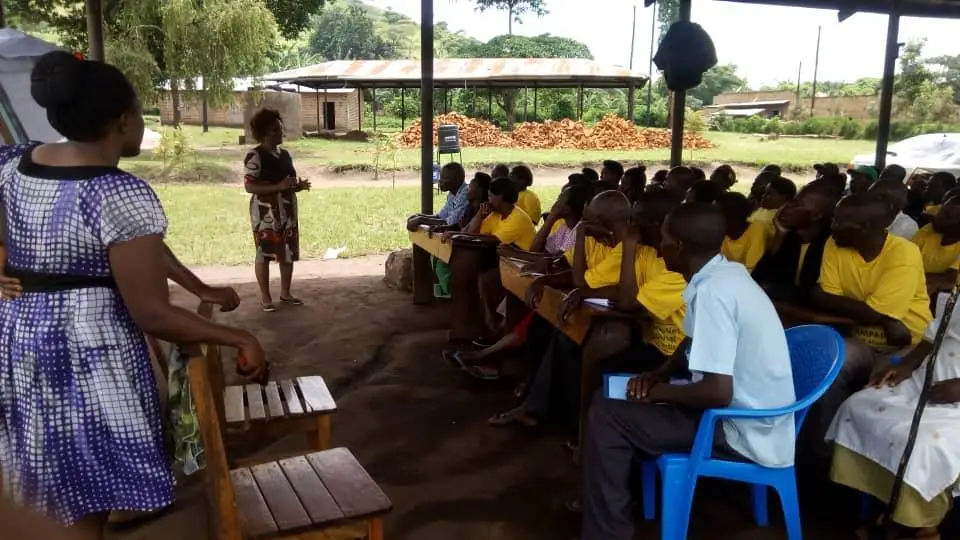 Project team member training VHTs in Kabarole during the project startup activities