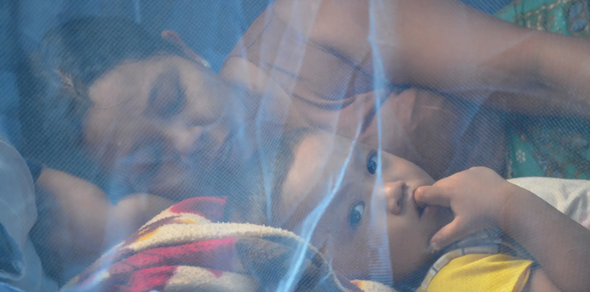 201312031106 mother and child under net kyun su township sept 2013 6
