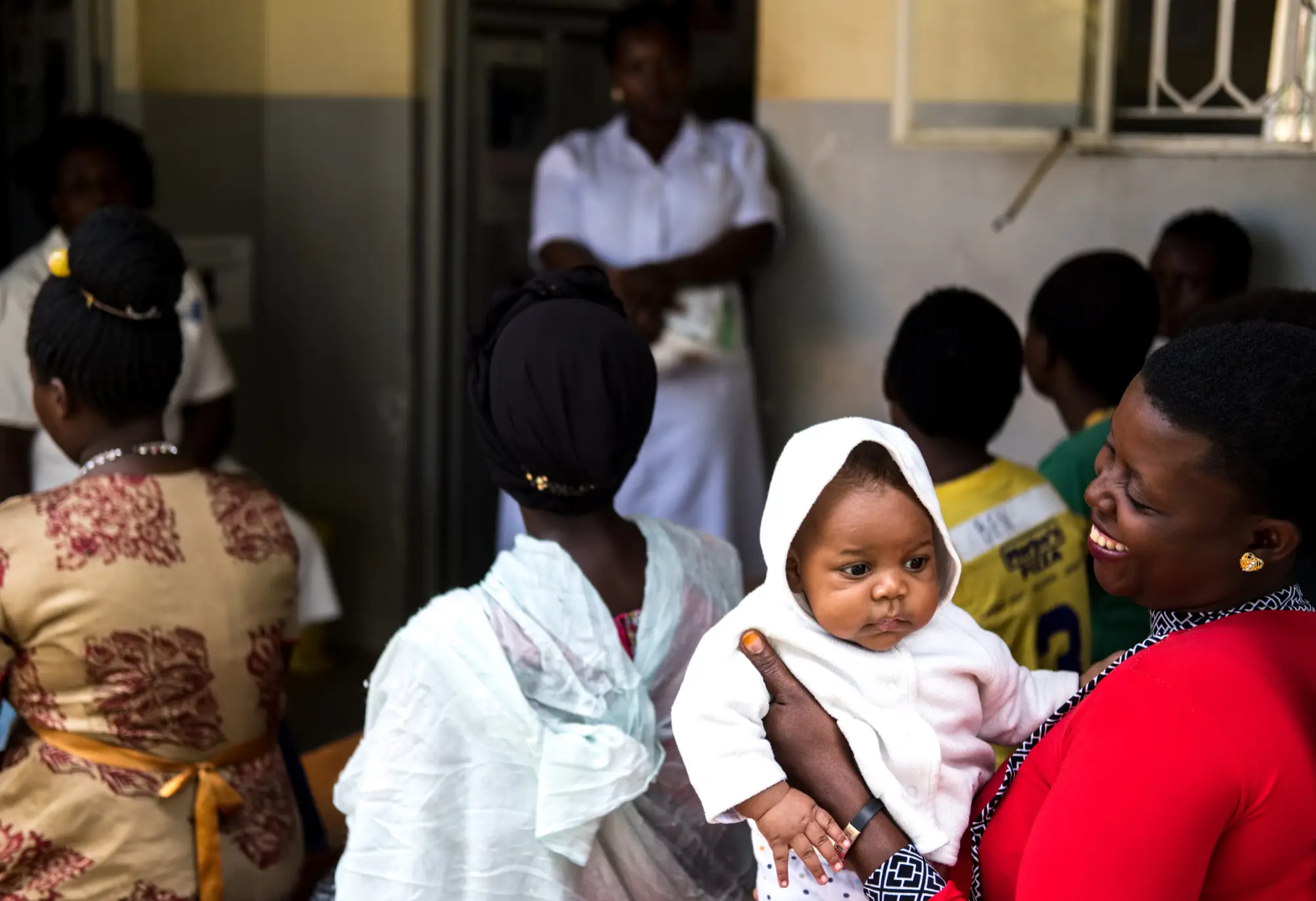 A woman holding a child in Masaka, Uganda