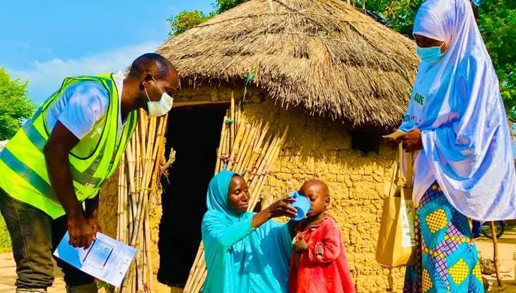 A child receives SMC medication in Nigeria