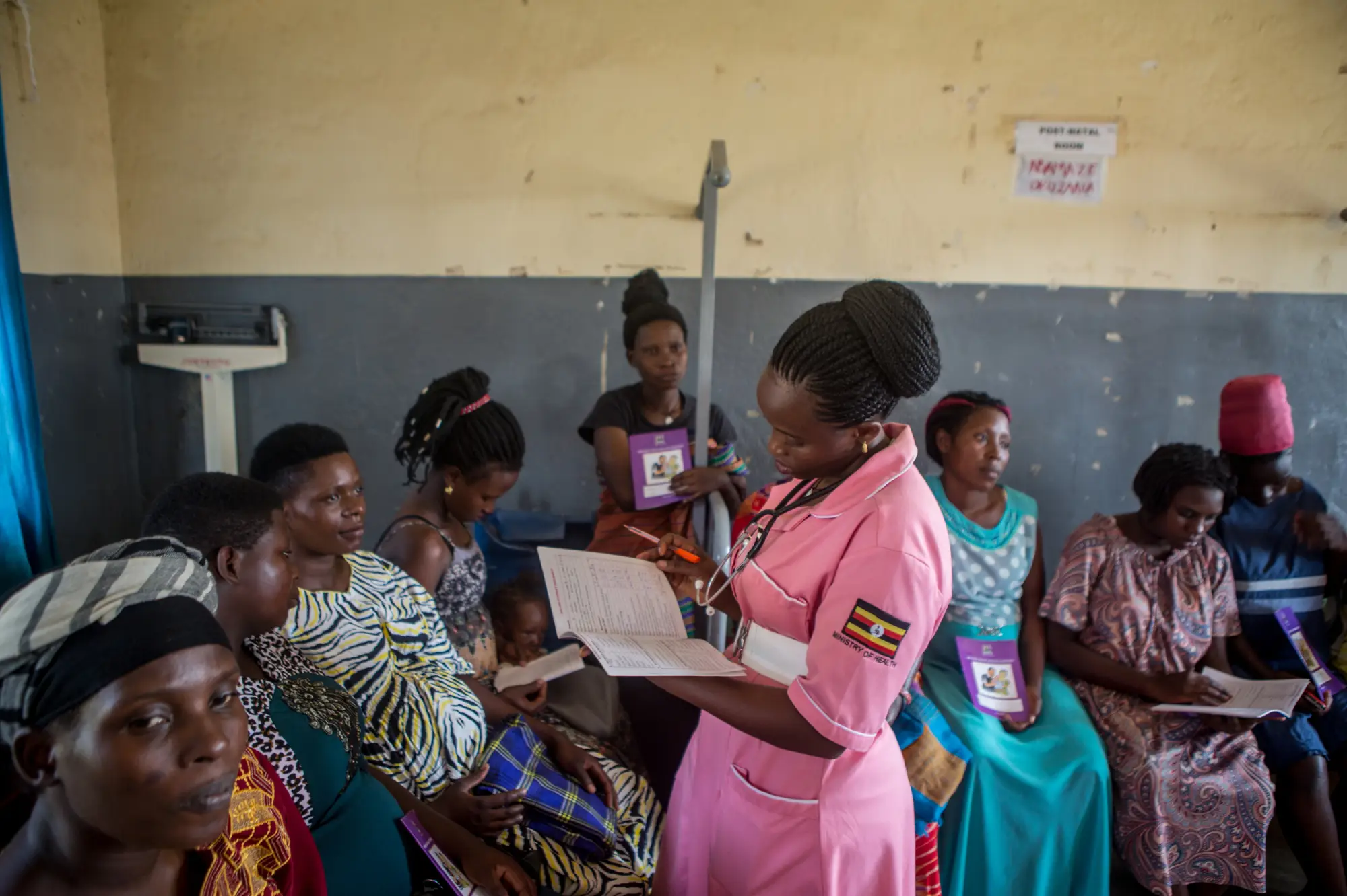 A community health worker talks to women in the community in Masaka, Uganda