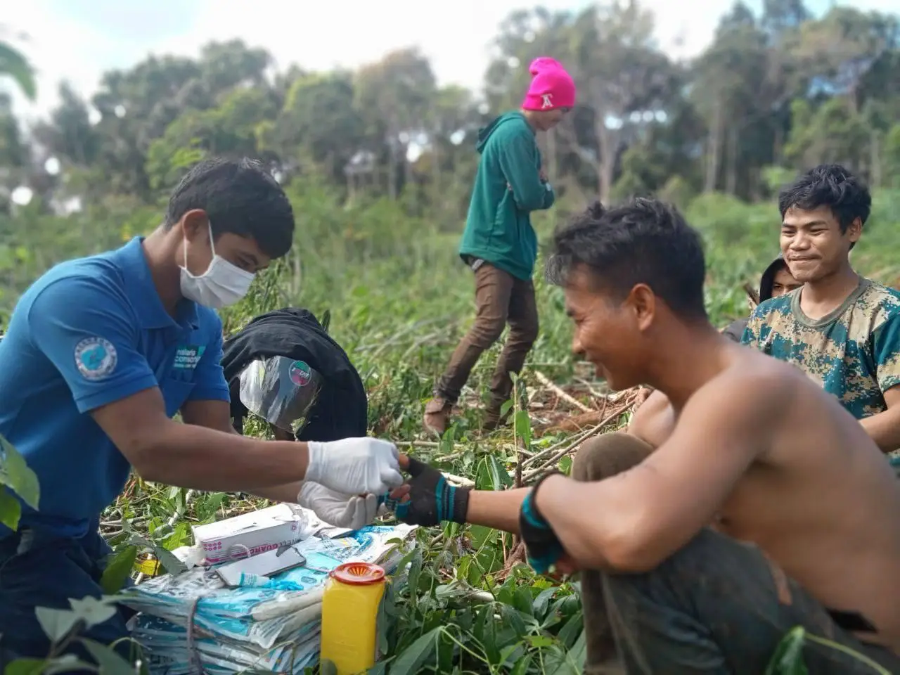 A worker is tested for malaria as part of the Cross Border project in Cambodia