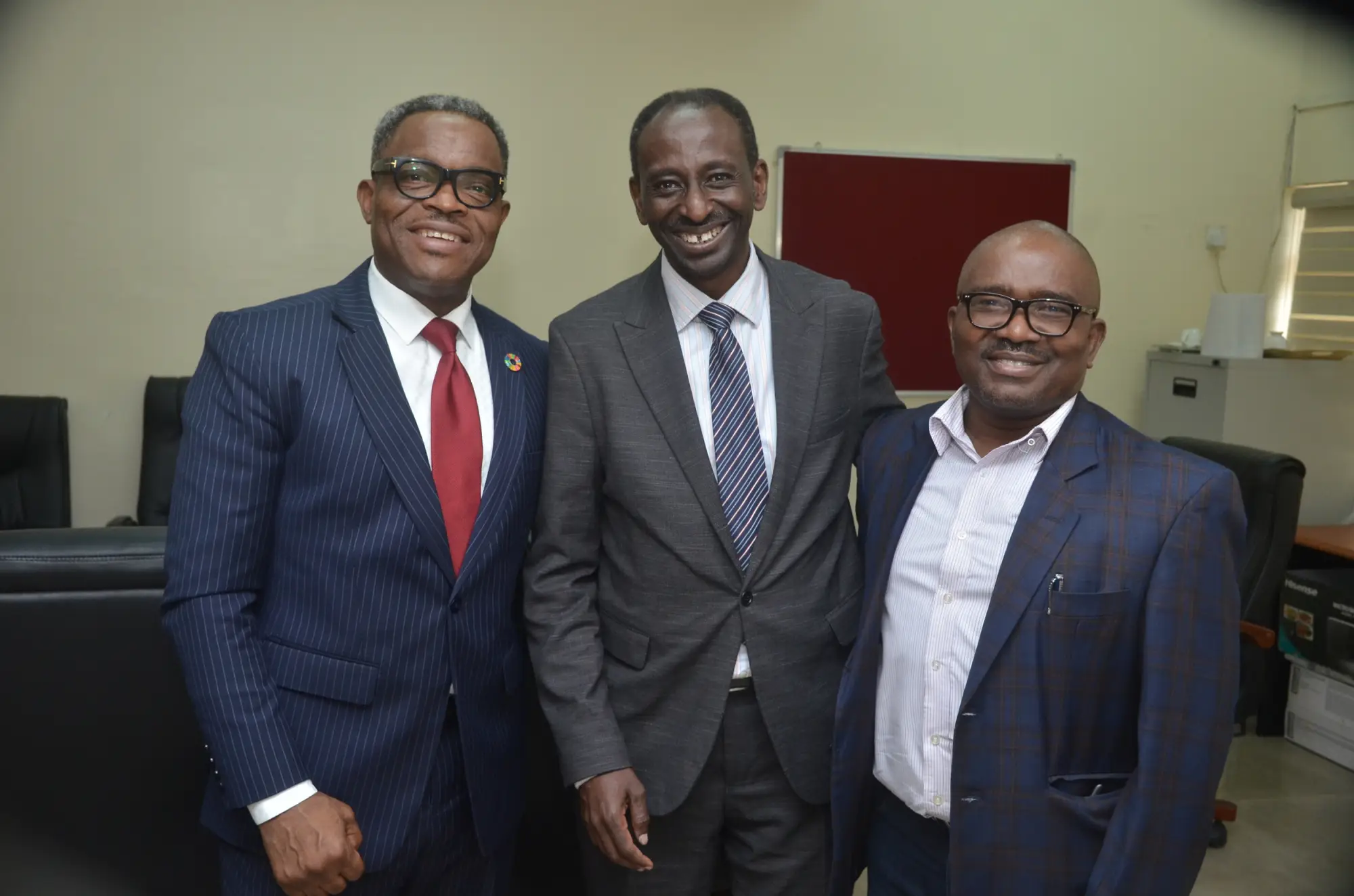 James Tibenderana with two men