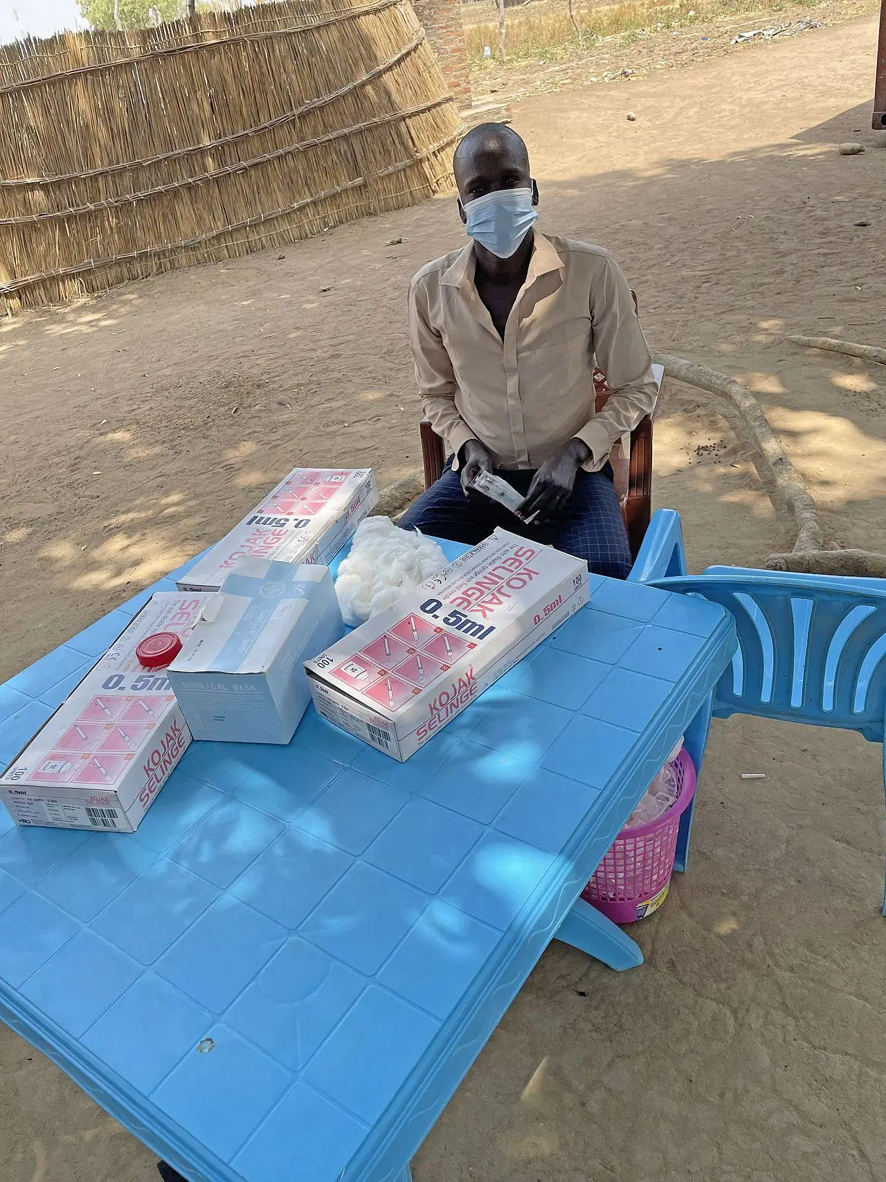 A trained volunteer administers the COVID-19 vaccine, Panthou Health Facility, Aweil South, South Sudan