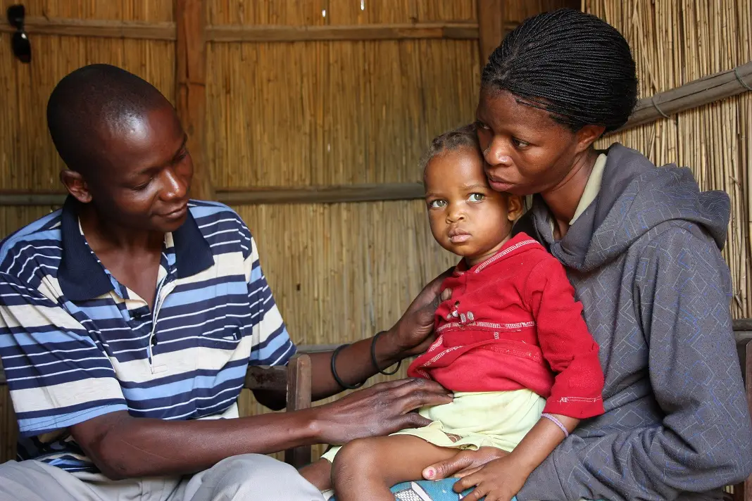 201410290251 ape miguel examining child who had stomach problems ruth ayisi
