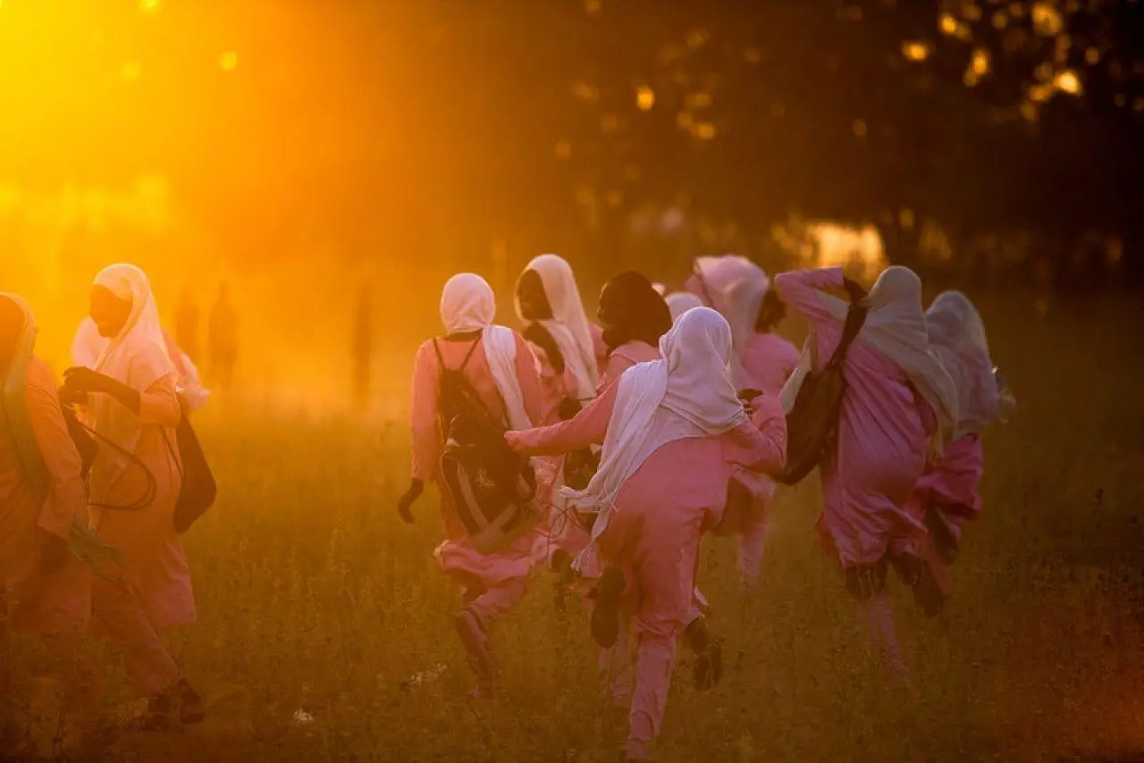 Group of women facing sunset