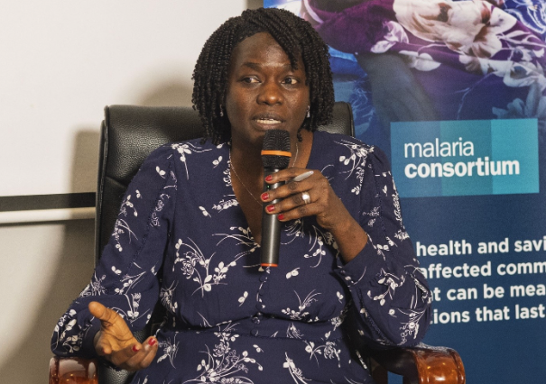 Jane Achan speaking into a microphone as a panellist