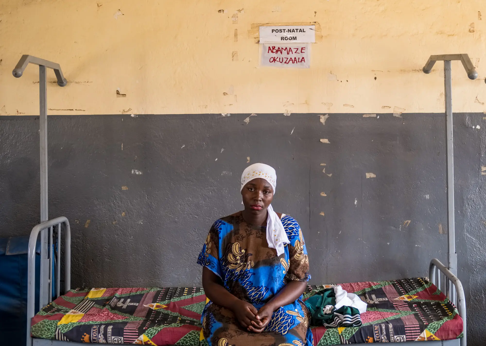 An expectant mother waits for a routine antenatal care appointment at Kinoni Health Centre III, in Lwengo district, Uganda