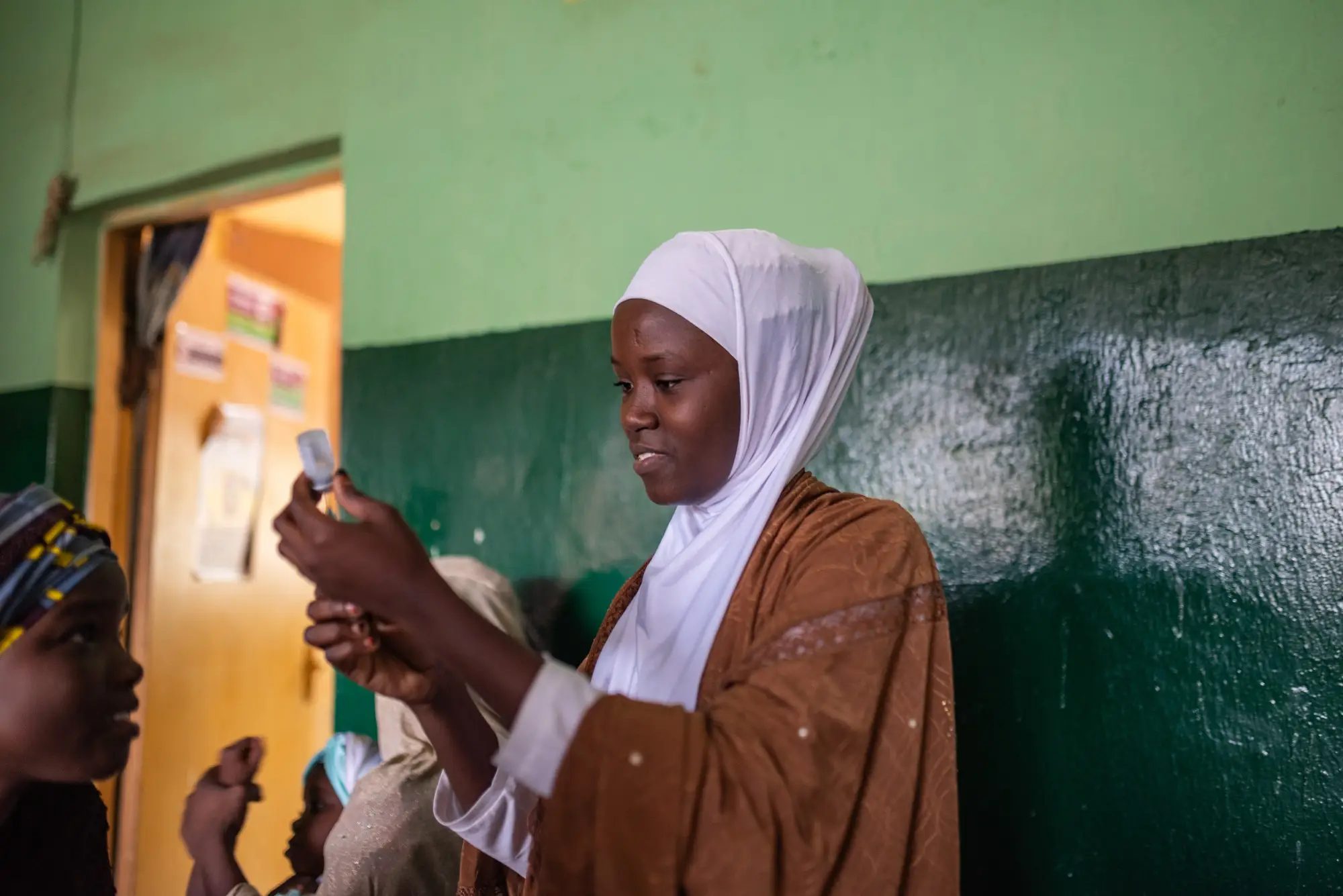 A woman prepares medication in Kano state, Nigeria in 2023