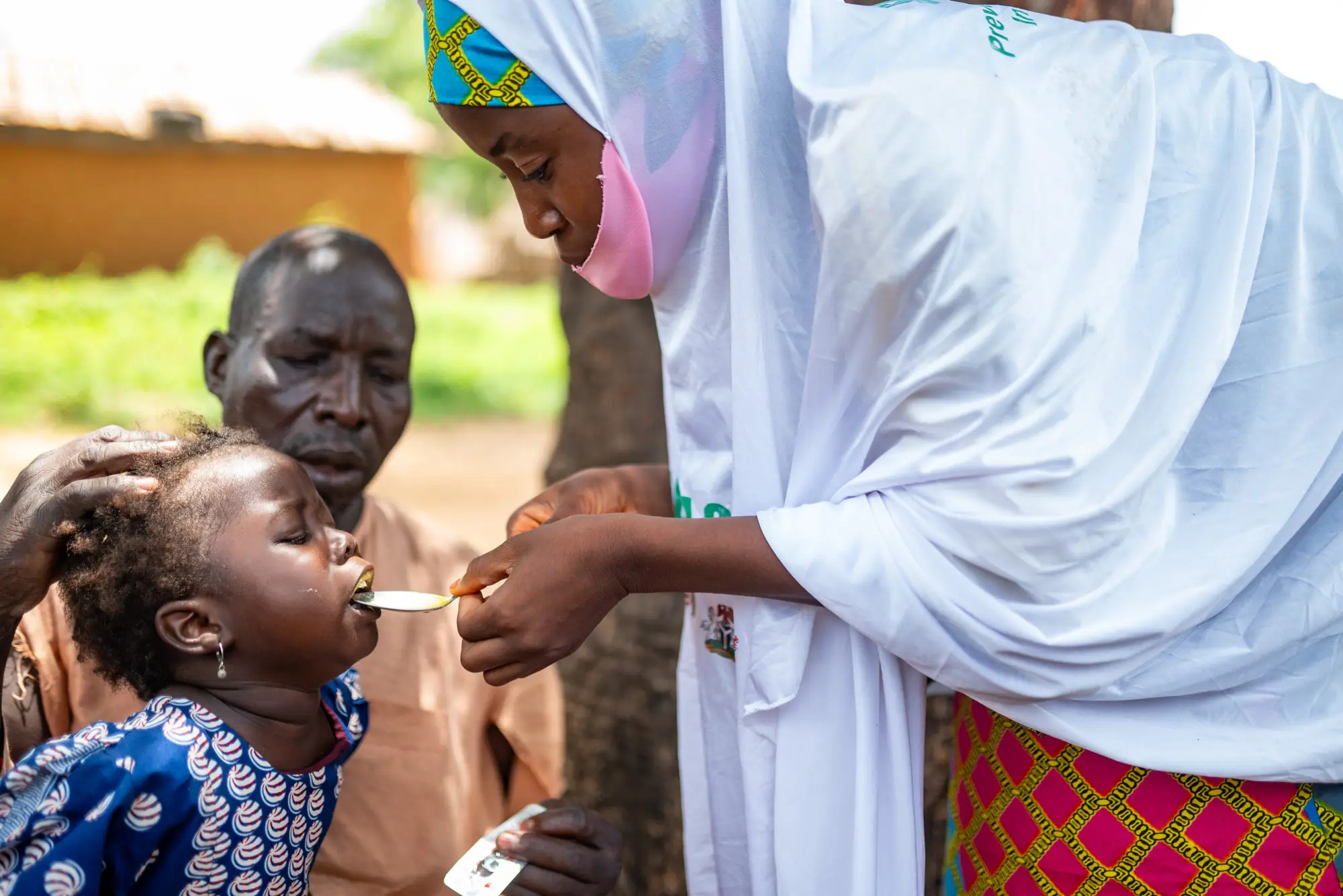A child receives SMC medication in Jigawa, Nigeria in 2023