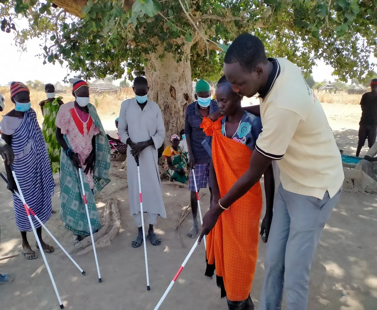 People being taught to use walking aids