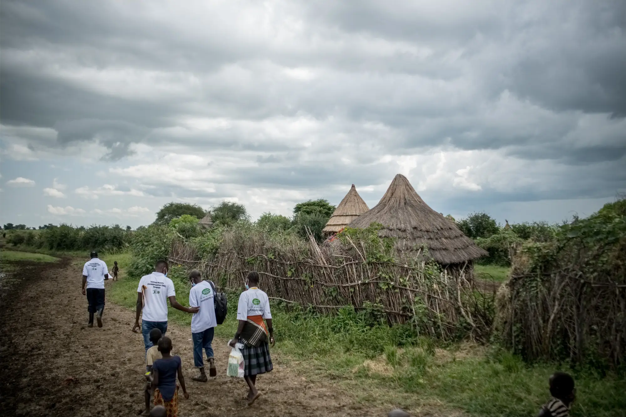 Village health teams traverse homesteads for a seasonal malaria chemoprevention exercise in Karamoja, Uganda