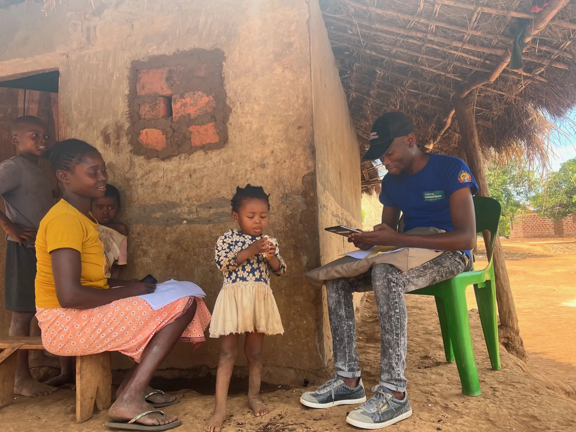 Data collection for ZIDER study - data collector visits a household in Mocuba district, Mozambique