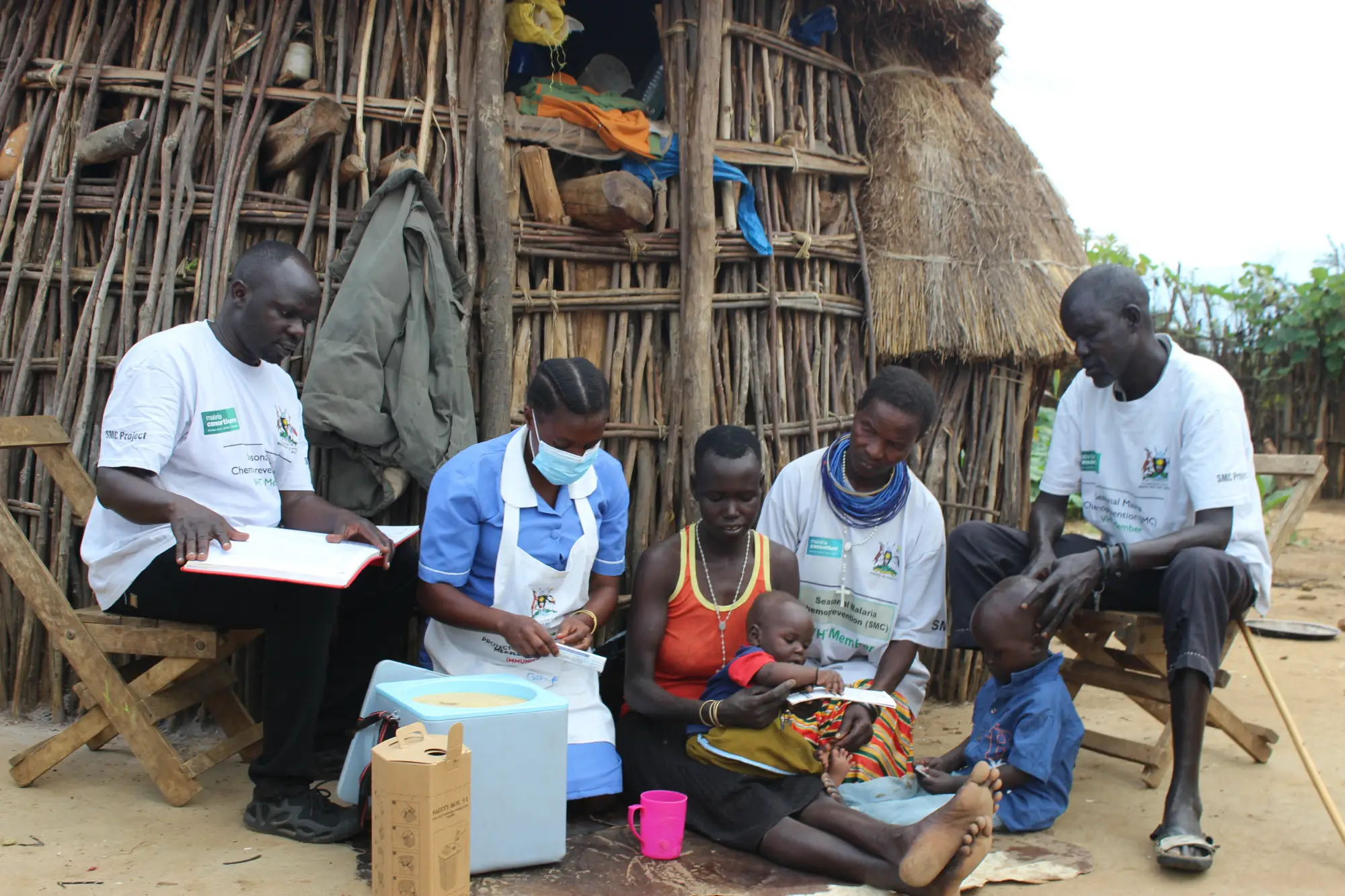 Frontline workers engage caregivers in a home-based consultation, combining service delivery with education to strengthen understanding, trustand sustained malaria prevention practices.