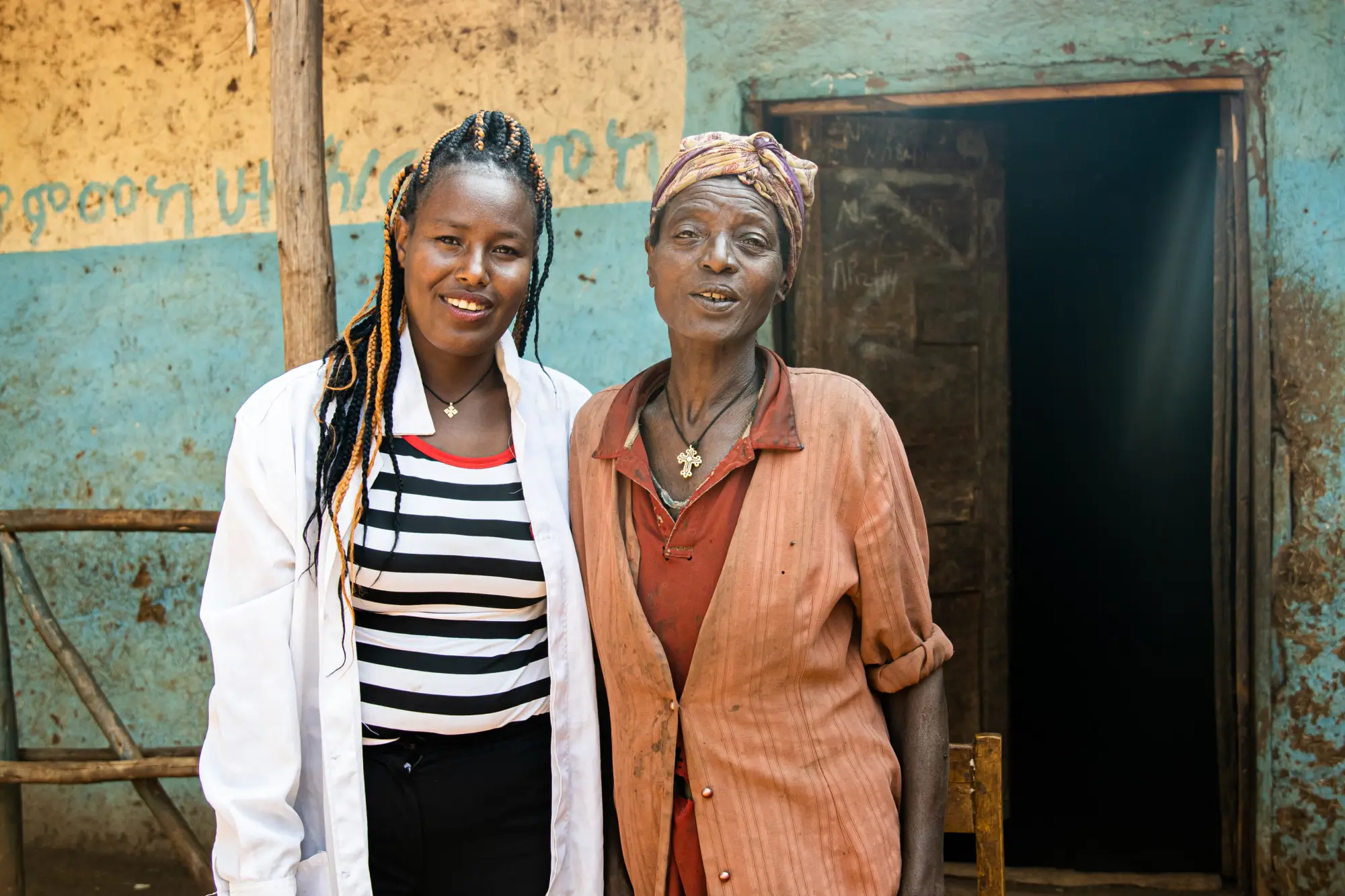 Metekae Dema, Health Extension Worker, with Aster Asale, a podoconiosis patient during her home to home visit of patients in Wadae Kero kebele, Sodo zuriya, Wolayita, Southern Ethiopia regional state