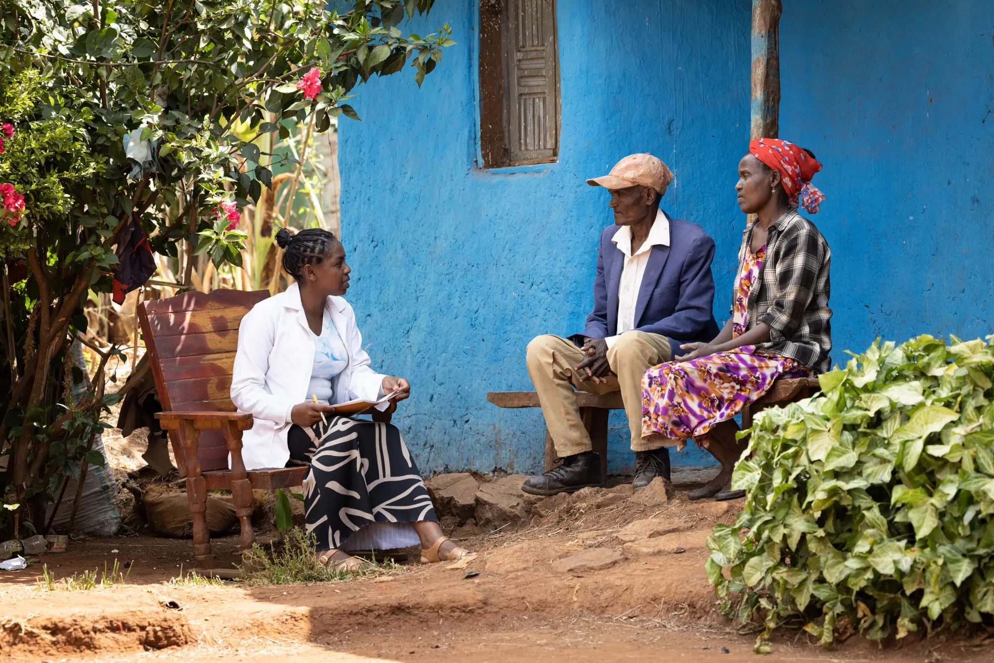 Meselech Meskele, Health Extension Worker, provides a podoconiosis patient with advice on how to take care of his feet during her door to door follow-up visit, Offa woreda, Wolaita zone, South Ethiopia Region, Ethiopia