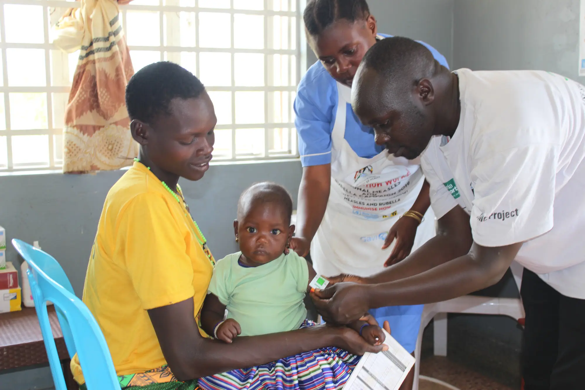 A health worker administers a malaria vaccine during a community 
outreach session in Karamoja, Uganda