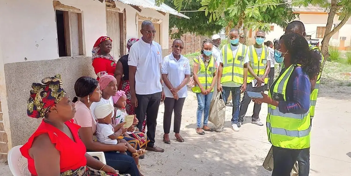 Community health workers speak with community members as part of the upSCALE digital health project in Mozambique in November 2023