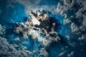 Image of sun behind clouds