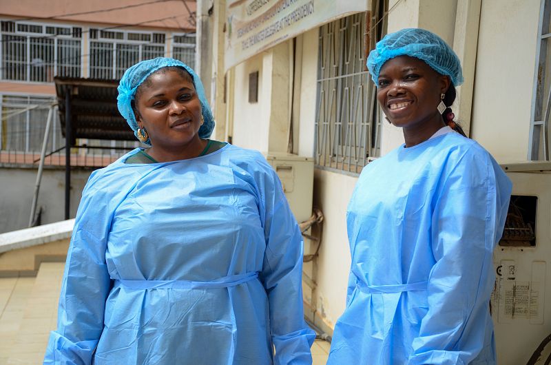 The image shows two women standing together after a laboratory visit as part of capacity development for arbovirus response training in Africa