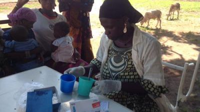 The Community Health worker prepares the SMC mixture