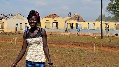 “My name is Florence, but I call myself ‘engineer Florence.’ I’m 26 years old. I am a teacher at the local technical school, but for the whole of the last week I have been here waiting for the building to be finished. I will begin the wiring [for electricity] right after the roof is finished.”
-Florence, electrician 