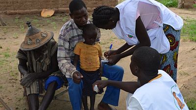 A child in Burkina Faso is registered for SMC treatment.
