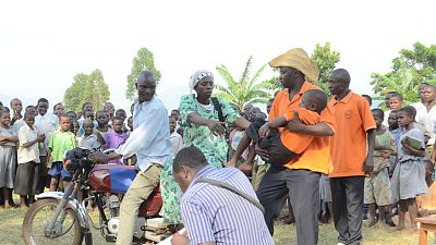 Drama groups provide another innovative platform to spread health messages among communities. In this photo, a community in Mbale, Uganda watches a performance that shows what to do when someone falls sick from malaria.