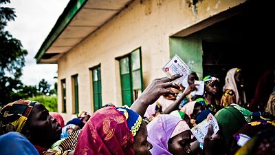 A crowd of women wait outside the LLIN collection point with their vouchers in hand. Across Nigeria, SuNMaP has procured and distributed approximately two million LLINs as part of its contribution to the national LLIN campaigns.