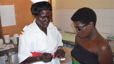 A pregnant woman receives intermittent preventive treatment in pregnancy (IPTp) at a health facility in Uganda as part of her antenatal care. Malaria Consortium has been conducting research to determine which barriers are holding back the uptake of IPTp in Uganda.