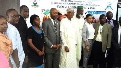 The Hon. Minster FMOH, Dr Khaliru Alhassan ((6th from left, in native dress), Permanent Secretary FMOH, Mr Linus Awute (5th from left), and Director, Child Health Dr Abosede Adeniran (4th from left), and representatives of partner organisations, at the press briefing on World Pneumonia and Prematurity Day In Nigeria, Nov 18, 2014
