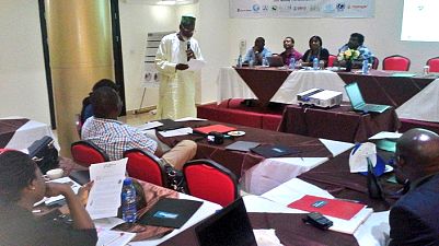 Dr Nosa Orobaton (standing) responds to some issues raised at the roundtable on World Pneumonia and Prematurity Day. 