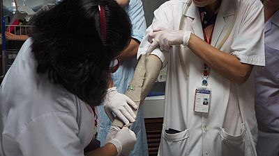 The arm-in-cage repellency test demonstrates mosquito landing and feeding activity on an untreated arm compared to an arm covered with a type of treated cloth.